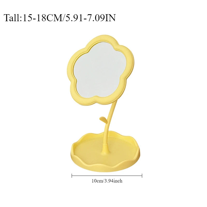 Yellow floral decorative desktop mirror with a scalloped frame and stand.