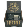 A dark wooden music box with a lid featuring an illustrated deer and crescent moon design.