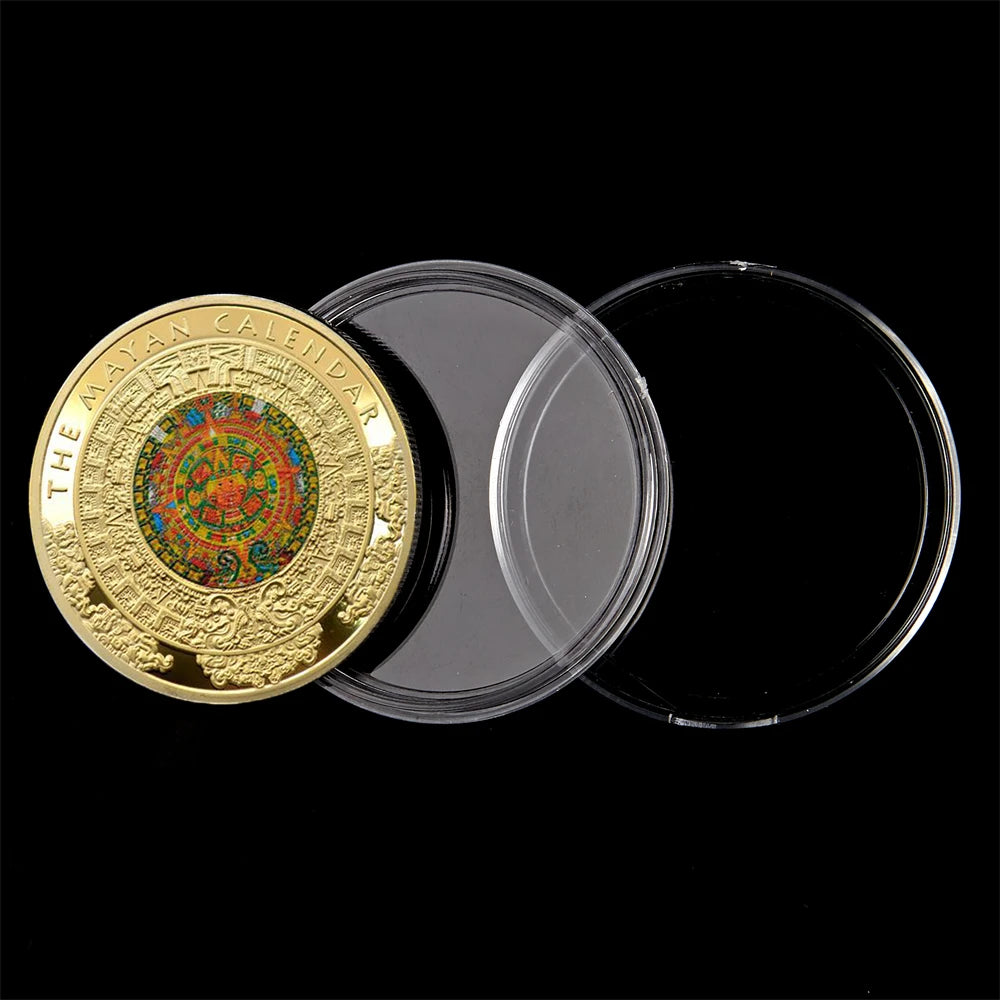 Gold-plated commemorative coin featuring a colorful Mayan calendar design, displayed next to clear plastic discs.