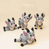 A set of three 3D printed goat figurines with movable joints in gray and white.