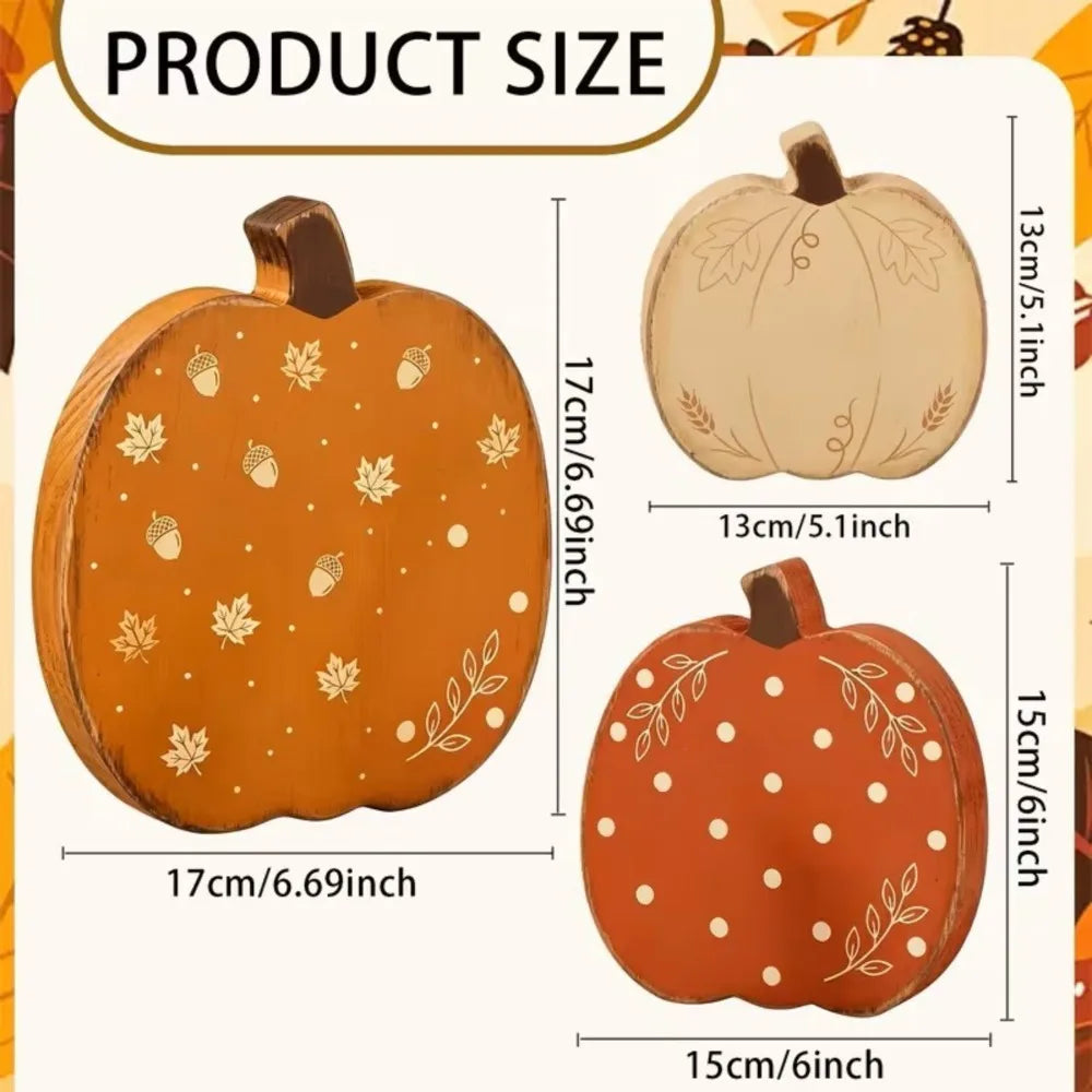 Three wooden pumpkin figurines in orange and natural tones shown with size measurements.