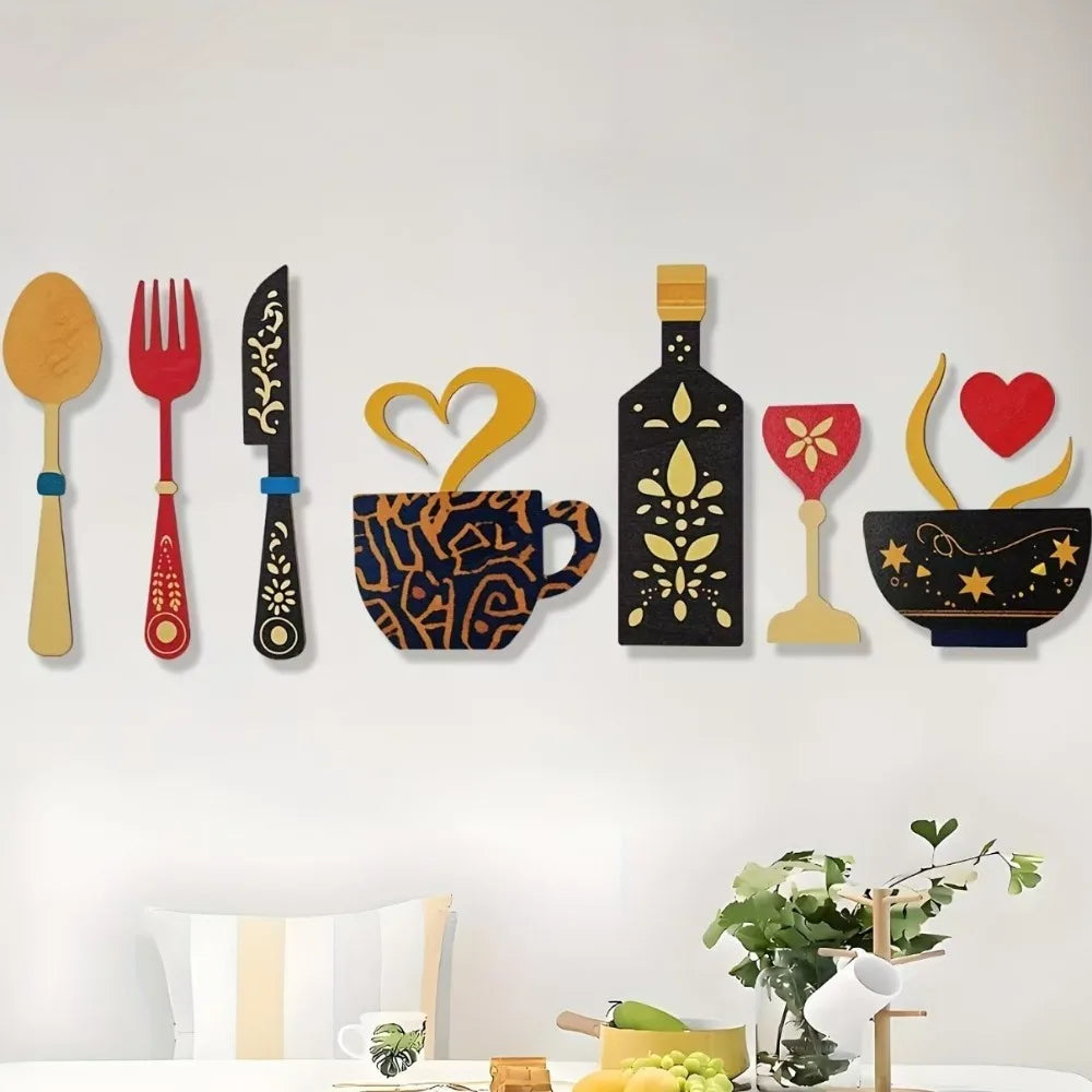 A set of rustic wood floral kitchen decor including a spoon, fork, knife, mug, bottle, and bowl.