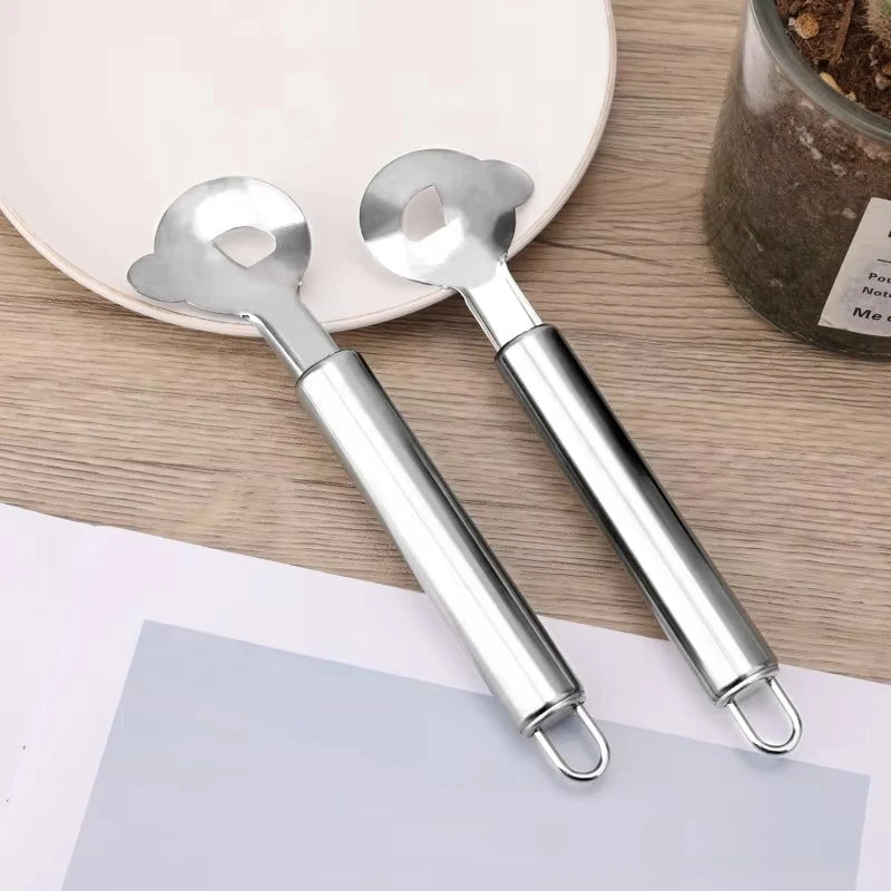A pair of silver Nopal cactus peeler and cutter tools resting on a light surface.