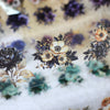 Floral PET sticker rolls featuring dark and light colored flowers for journaling and scrapbooking