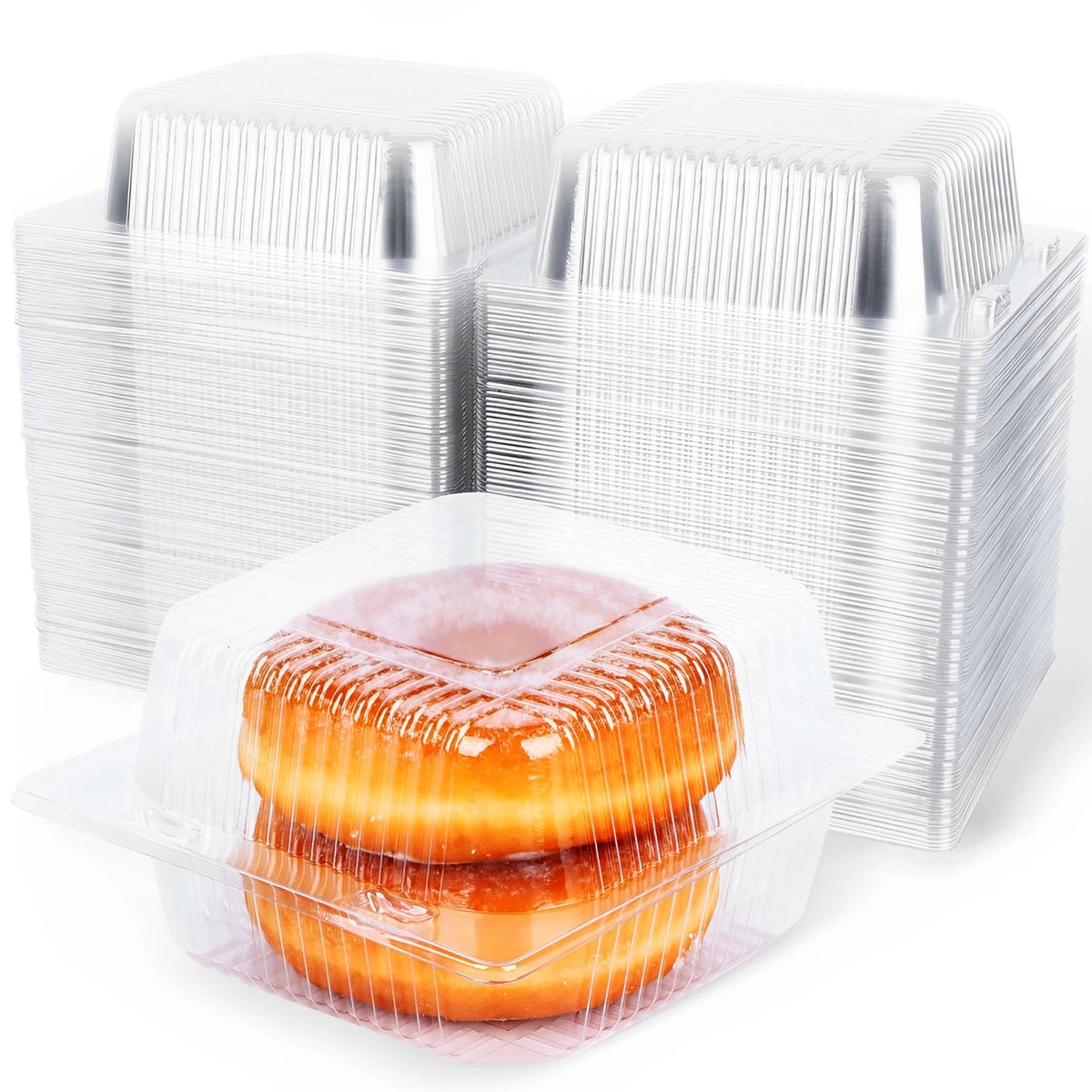 A stack of clear plastic cake slice boxes with lids, including one filled with an orange-colored cake slice.