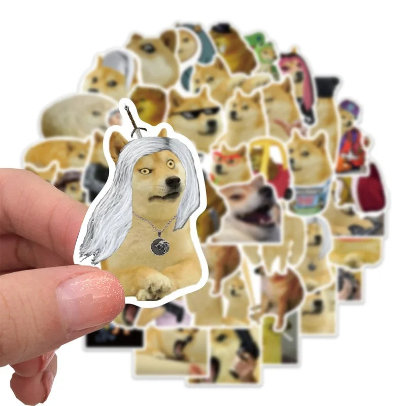A hand holds a collection of funny cartoon dog meme decals featuring various dog breeds and expressions.