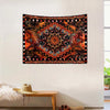 Bohemian sun and moon tapestry wall hanging featuring intricate geometric patterns in orange, black, and pink tones.
