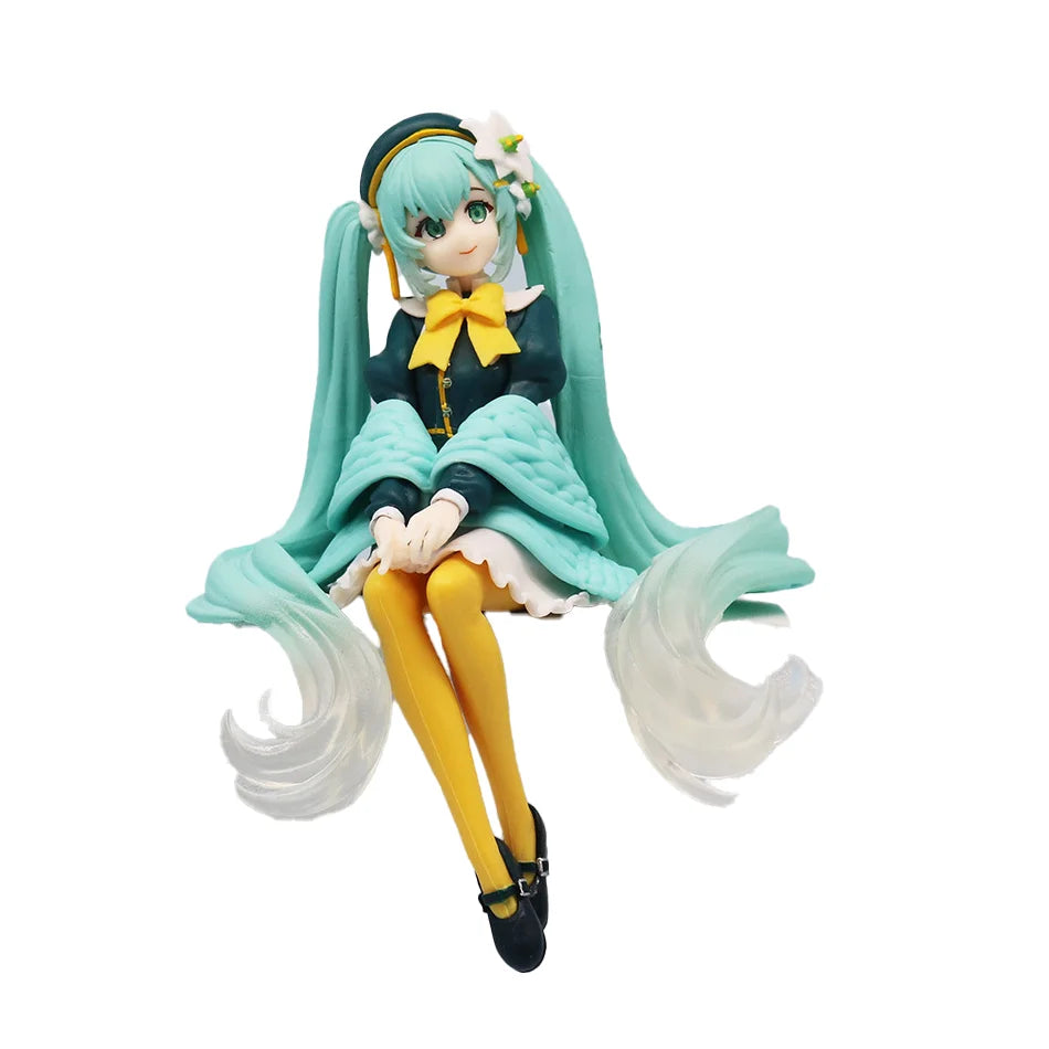 A PVC collectible figurine of Hatsune Miku, featuring teal hair and a yellow bow, in an anime style.