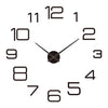A black and white analog clock face showing the time is approximately 12:00.