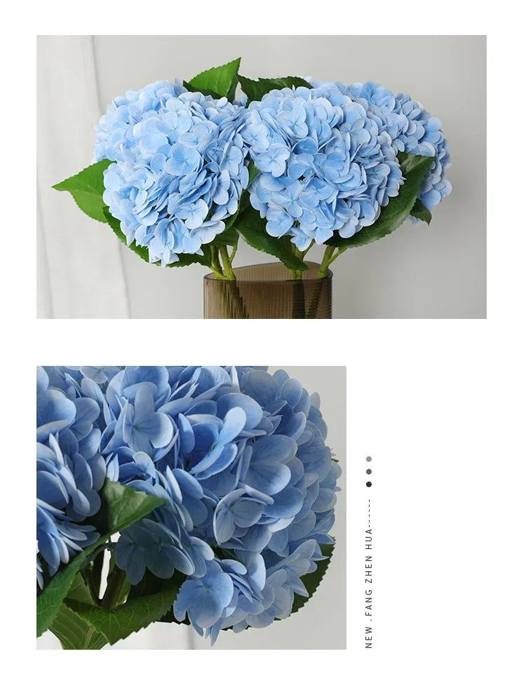 A cluster of light blue artificial hydrangea flowers in a green vase.