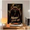 A poster of Cristiano Ronaldo in a dark jersey with the text Never give up displayed on a wooden shelf.