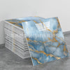 Rolls of faux marble 3D self-adhesive wall tiles featuring blue and gold veining