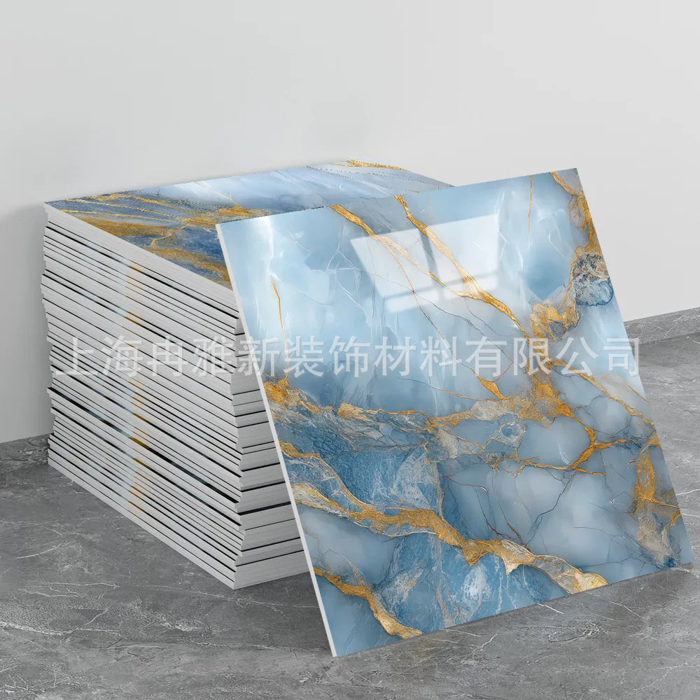 Rolls of faux marble 3D self-adhesive wall tiles featuring blue and gold veining