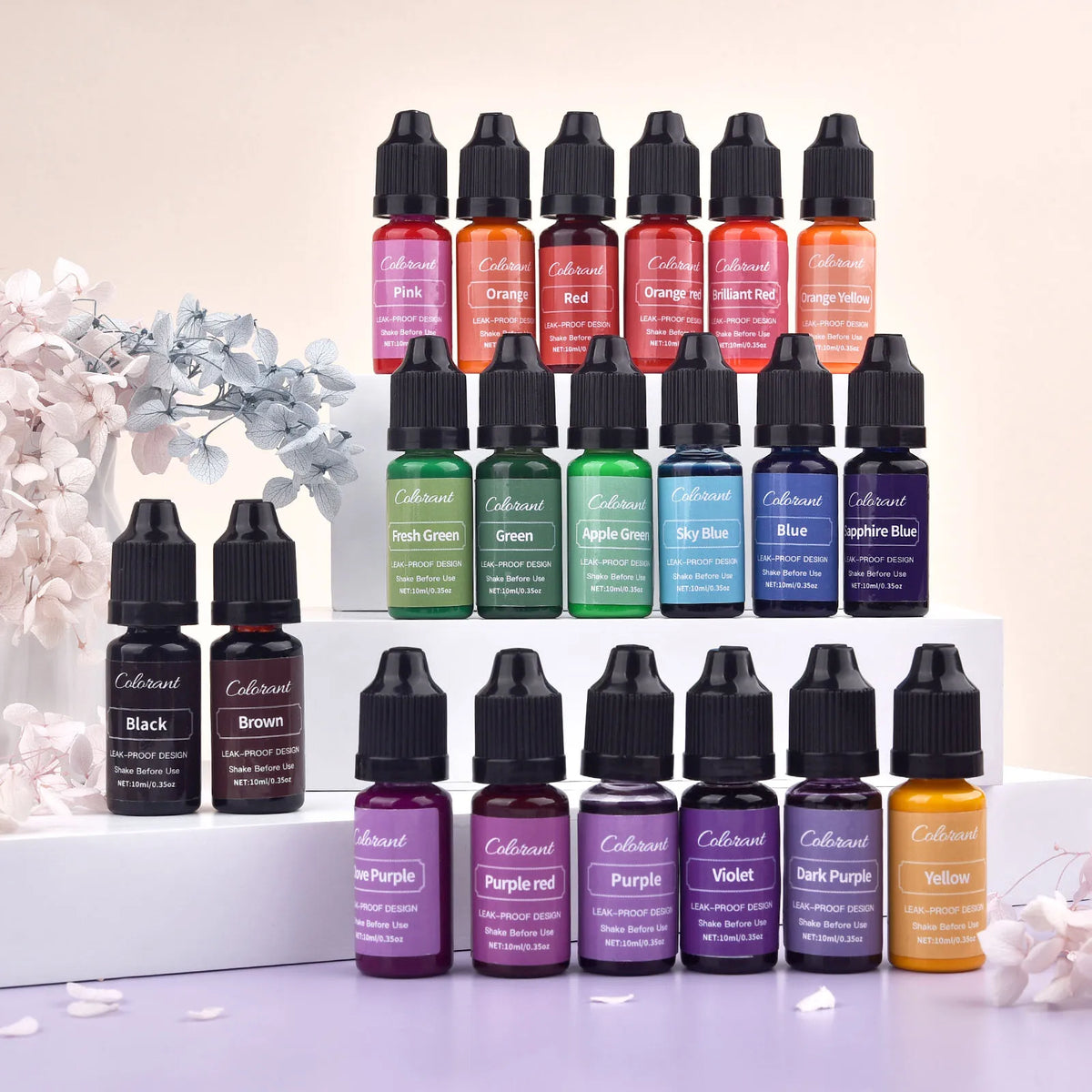 A collection of 20 liquid colorants in various shades including pink, orange, red, green, blue, and purple bottles for candle
