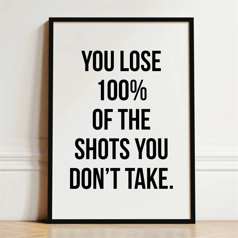Black framed canvas print with white text that reads You lose 100% of the shots you don't take.