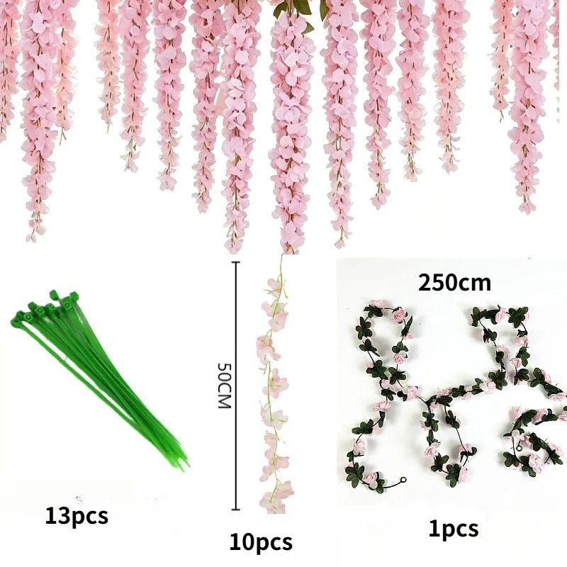Pink silk wisteria hanging vine garland featuring long drooping flowers and green stems