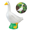A white goose garden statue with an orange beak and green feet, shown next to an inset photo.