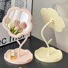 A pink sunflower heart dressing makeup mirror with a light yellow stand and mirror.