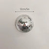 Silver disco ball decor with a 12cm diameter, mounted on a wall.