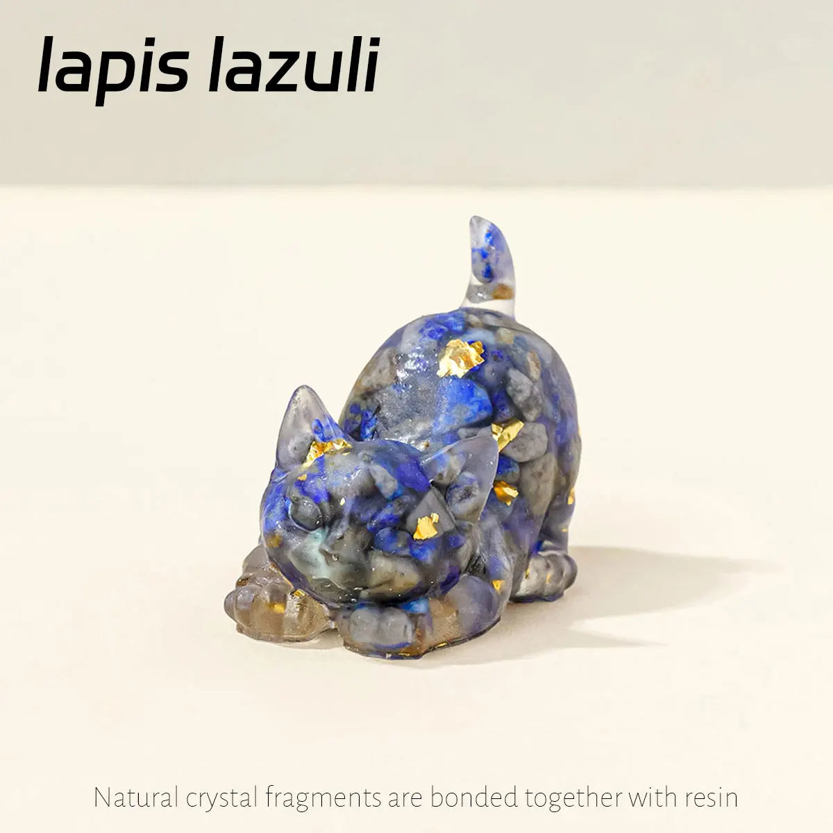A small statue of a cat made from blue lapis lazuli crystal fragments bonded with resin.