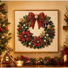 A framed Christmas wreath made of red berries and green foliage with gold accents.