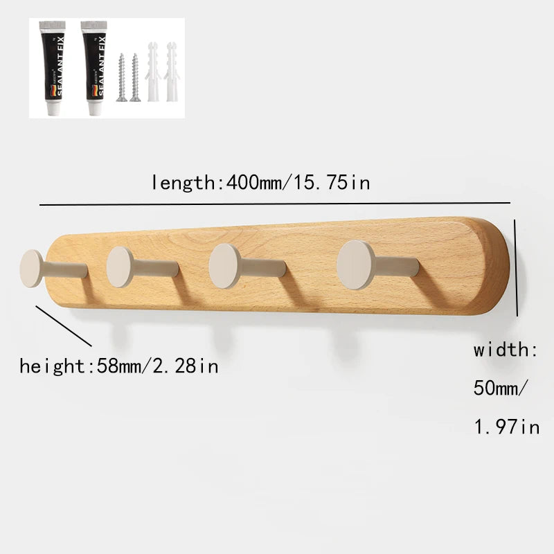 Solid beech wood wall hook rack with four wooden hooks shown in a close-up view.