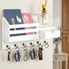 A white wall-mounted organizer featuring a mail slot and a drawer, with several keys hanging below.