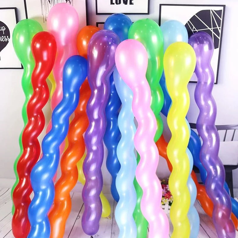 A collection of colorful spiral twist latex balloons in various shades including red, orange, blue, purple, pink, and green.