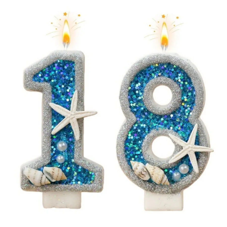 A set of number candles for an 18th birthday featuring glittery blue and silver designs with starfish accents.