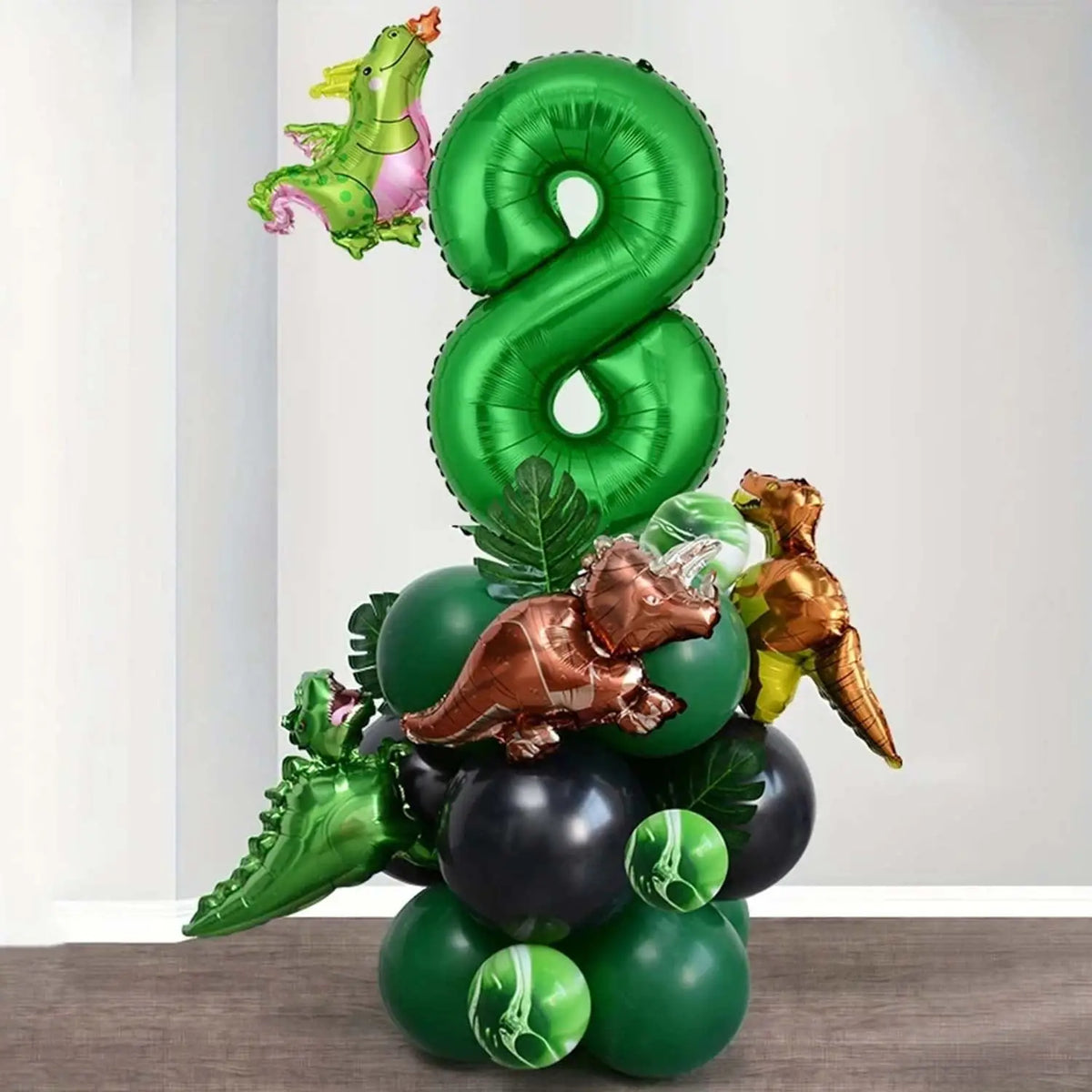 A green balloon set featuring a large number eight, a green dragon, and several dinosaur-themed balloons.
