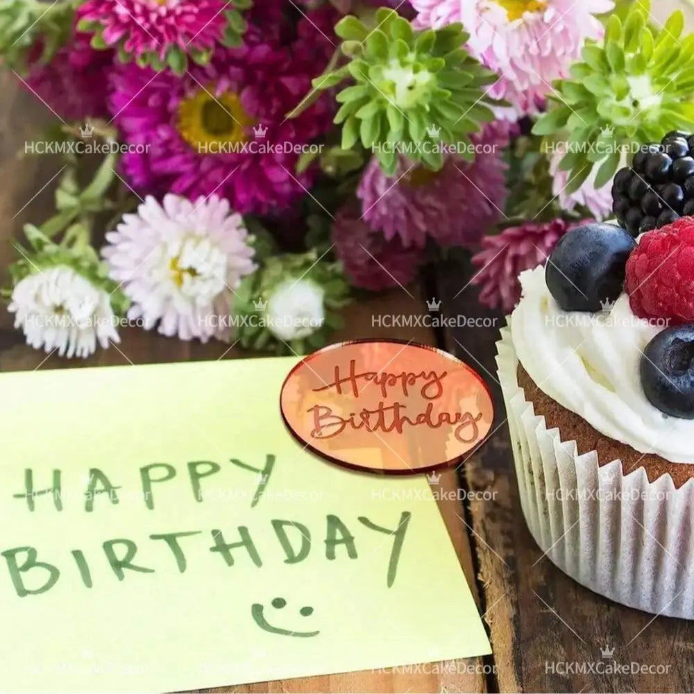 A birthday cake decorated with fresh berries and cream, next to a yellow note wishing a happy birthday.