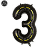 Black inflatable number three balloon with yellow accents for a birthday party
