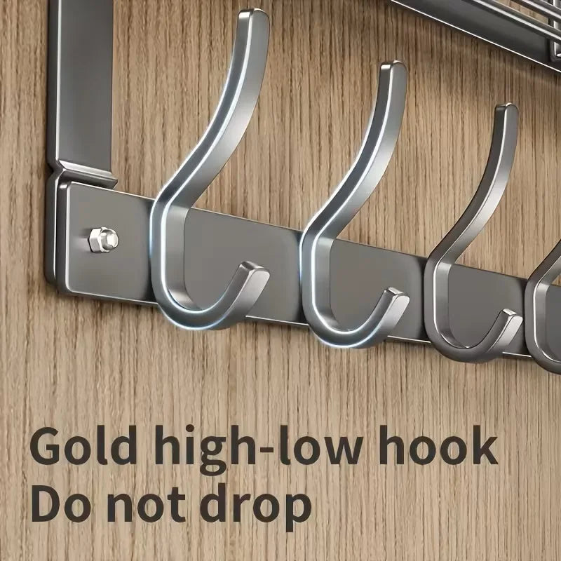 A close-up of a gold high-low hook over-the-door organizer rack designed to prevent items from dropping.