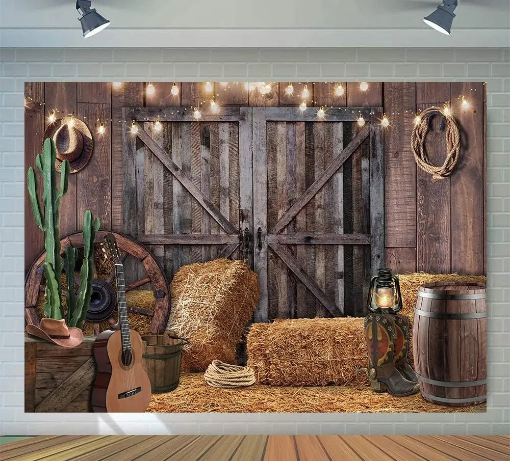 A rustic backdrop featuring a weathered wooden barn door, hay bales, and leather goods for western photography.