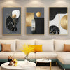A set of three abstract marble geometry canvas art pieces displayed on a wall above a modern sofa.