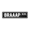 Black rustic metal sign with white text reading BRAAAP BLVD
