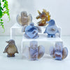 A set of natural agate crystal figurines depicting various birds and animals like an owl, penguin, and lion.