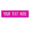 A bright magenta rectangular sign with the text YOUR TEXT HERE.