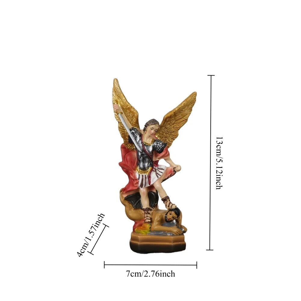A resin statue of Saint Michael the Archangel with wings and a sword, mounted on a base.
