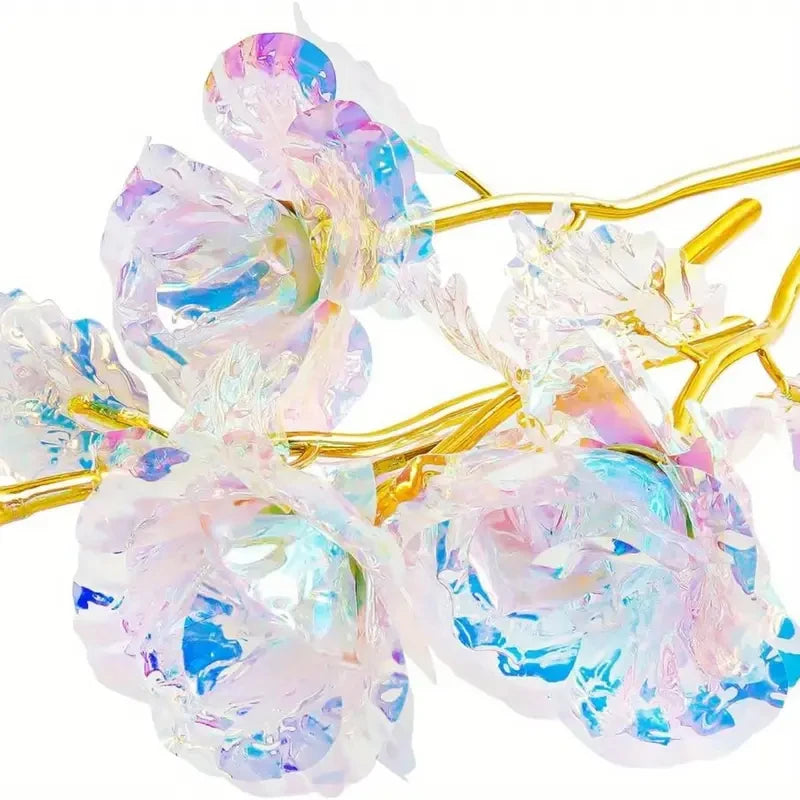 A cluster of realistic white artificial roses with iridescent pink and blue tones on thin gold wires.