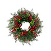 Artificial pine and eucalyptus wreath decorated with bright red berries