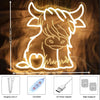 Dimmable neon sign of a Highland cow silhouette with hanging line and power adapter components
