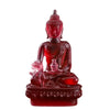 A handcrafted red resin statue of the Medicine Buddha with a serene expression and lotus base.