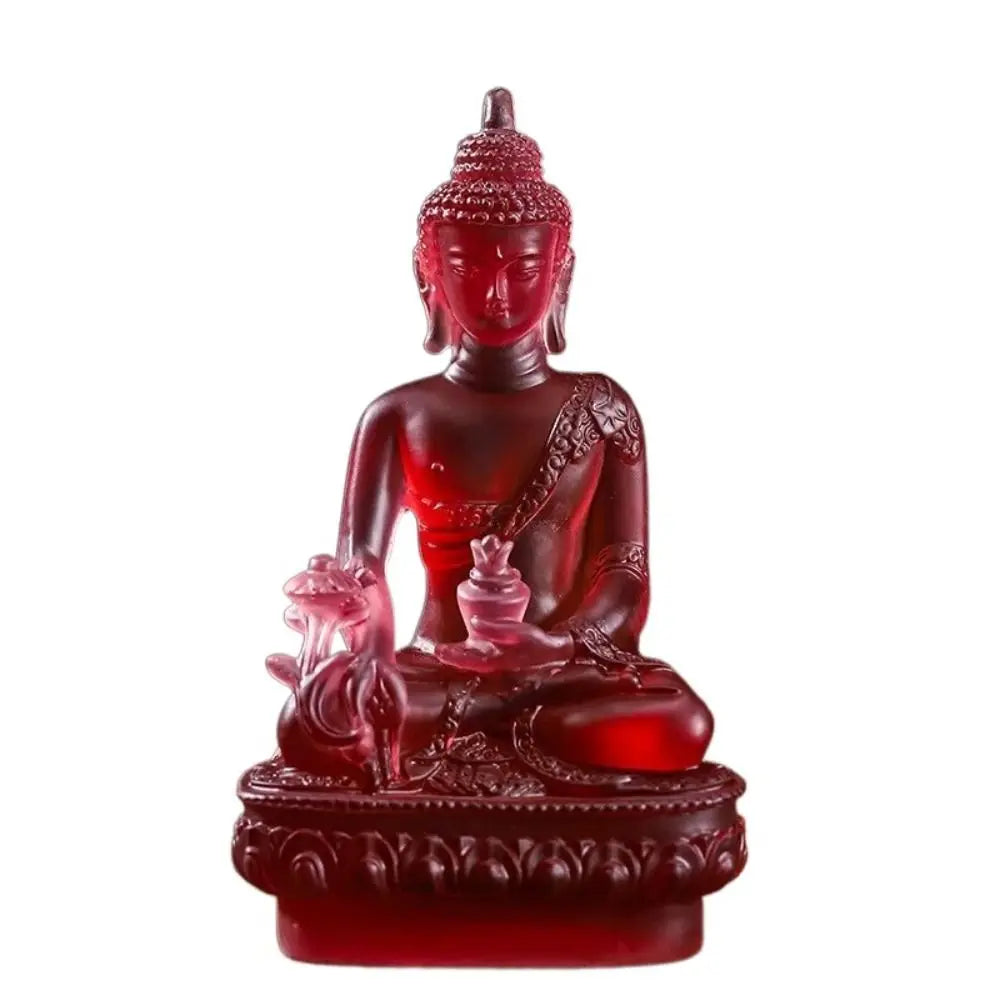 A handcrafted red resin statue of the Medicine Buddha with a serene expression and lotus base.