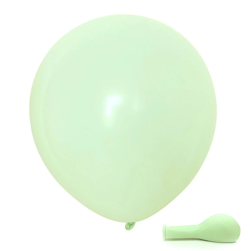 A single pale green balloon is shown next to a small, light green silicone tool.