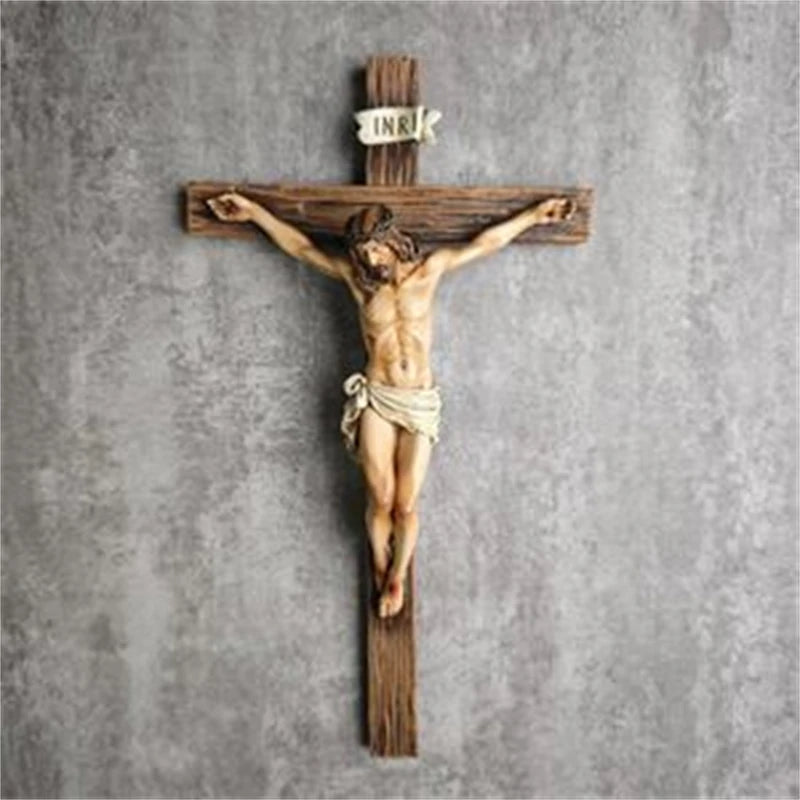 A wooden cross with a resin figure of Jesus Christ crucified, used for home or office decor.