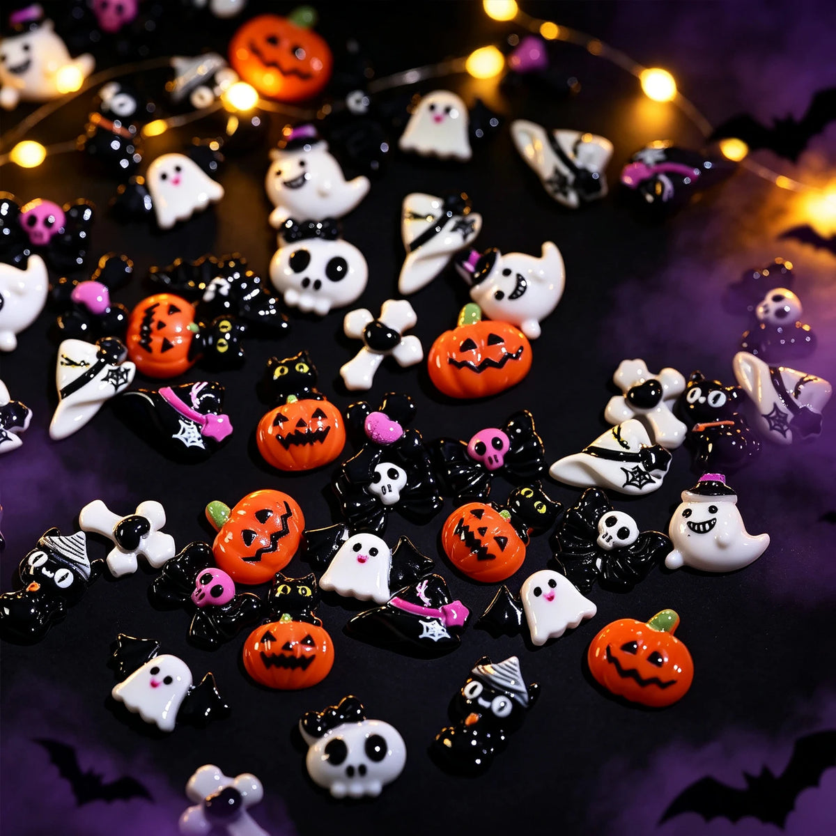 A variety pack of 50 Halloween resin nail charms featuring spooky characters like ghosts, pumpkins, and bats on a dark backgr