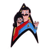 An enamel pin featuring a cartoon character with black hair and a mustache, wearing a blue shirt.