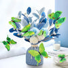 A decorative set of twelve green and blue 3D butterfly wall stickers arranged in a floral arrangement.