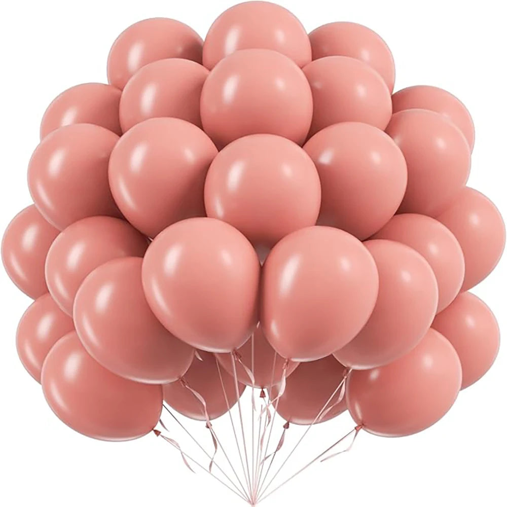 A bunch of pink pastel latex balloons tied together for party decorations